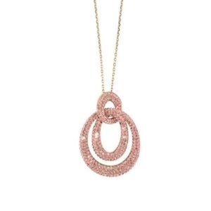 Atelier Swarovski Tigris gold tone Pendant necklace with pinkish undertones.